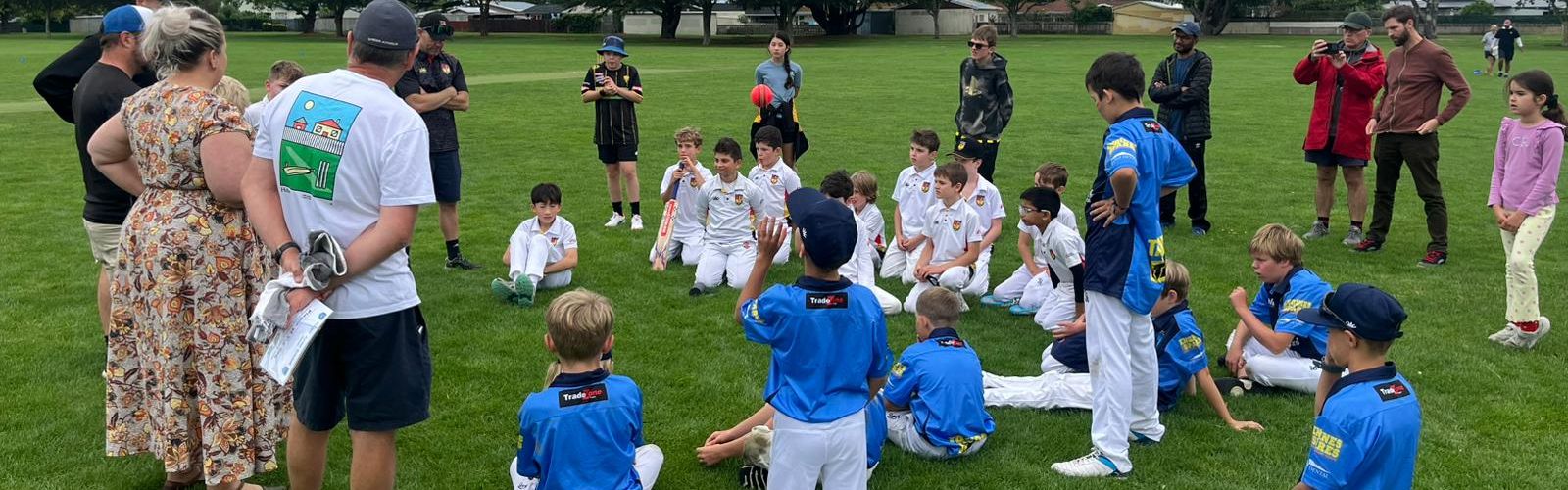 Taupō and opposition players gathered on the field after a game at Hawke's Bay Camp