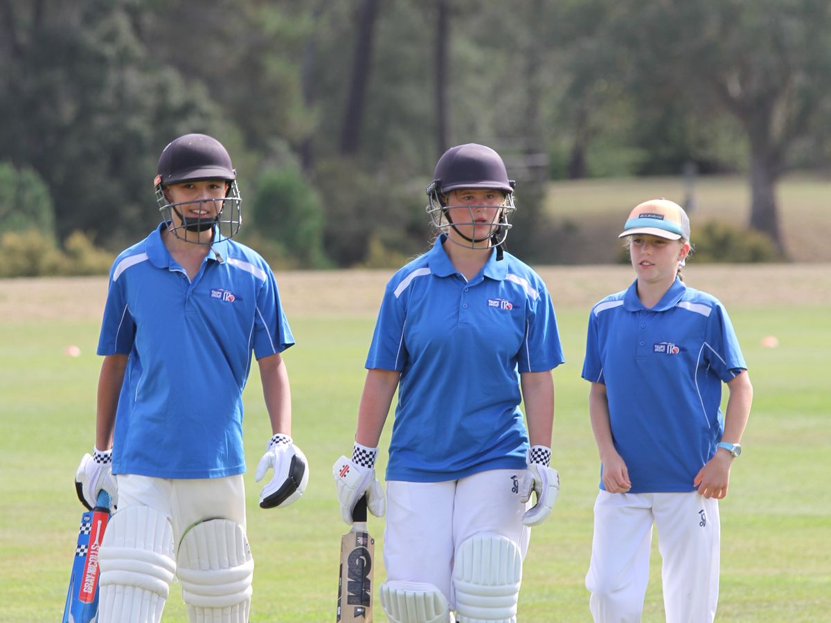 Two Taupō batters walking off the field