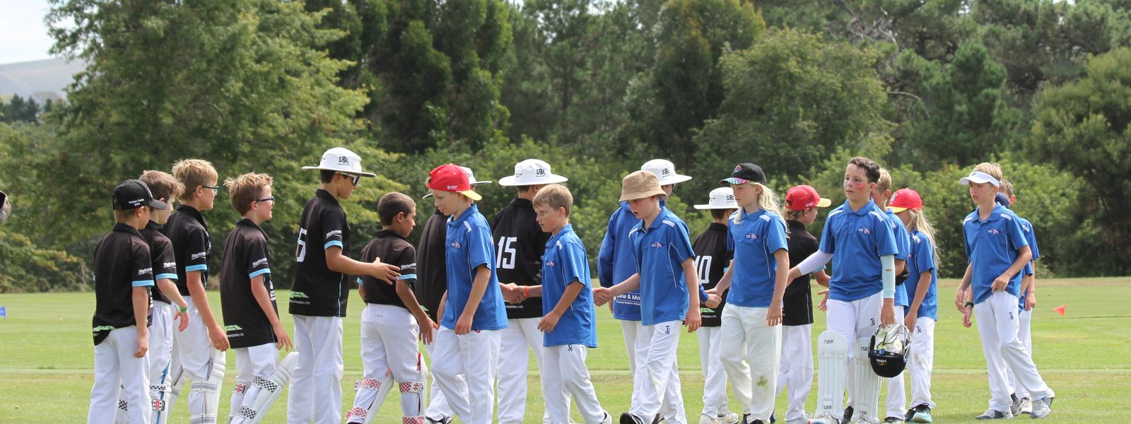 Taupō and visiting players shaking hands after a game