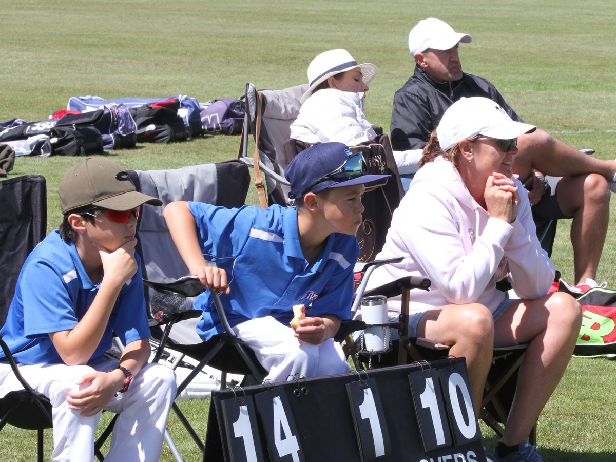 Players and parents watching from the sideline